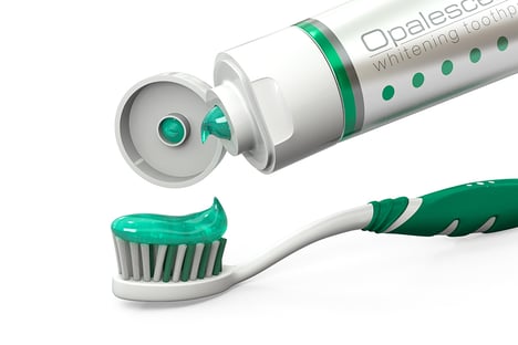 A picture containing toothbrush, indoor, green, cup
Description automatically generated
