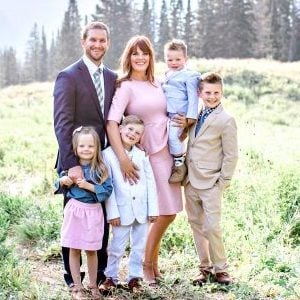 A group of people posing for a photo
Description automatically generated