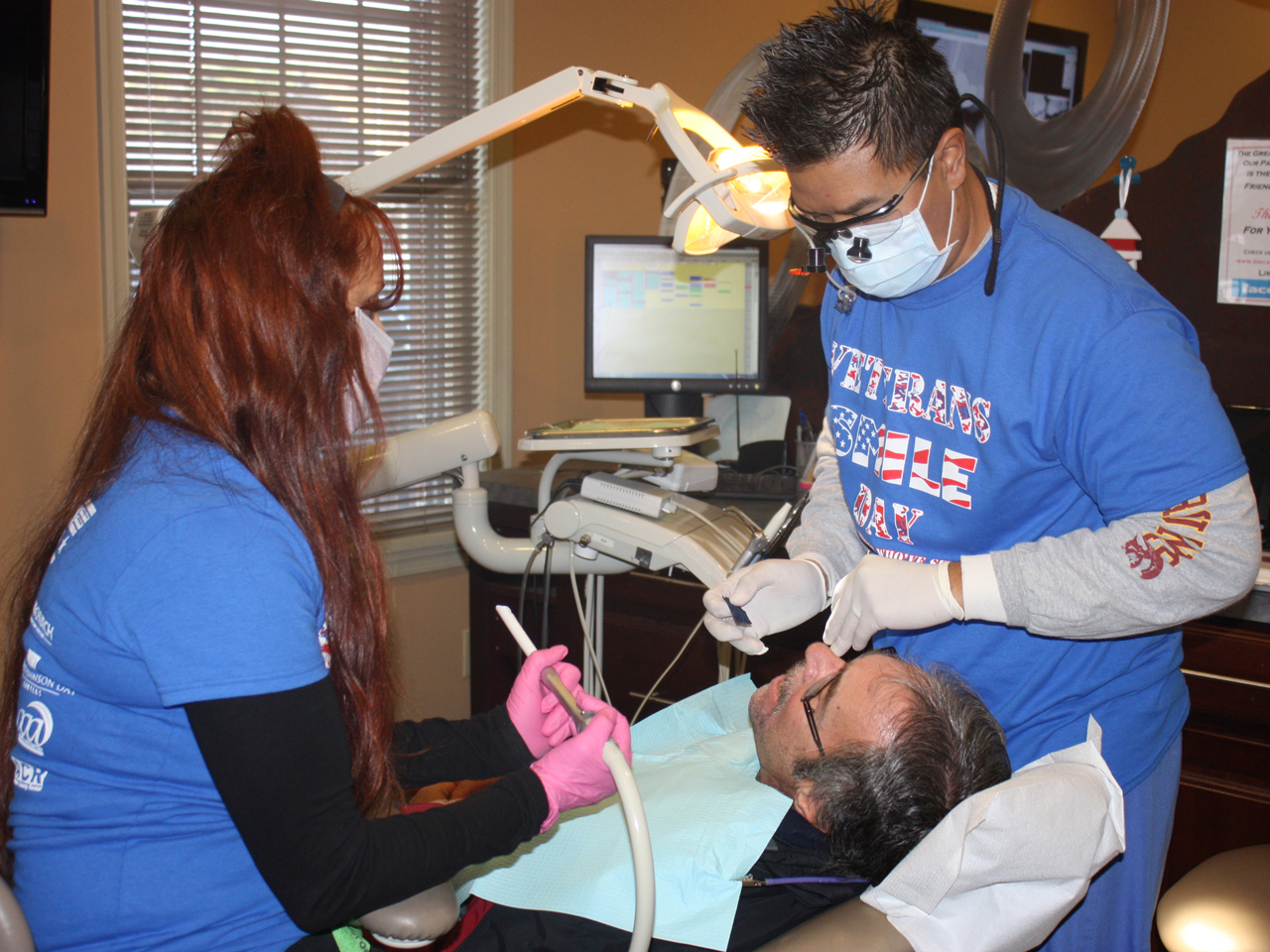 Derek Pham works on patient.jpg